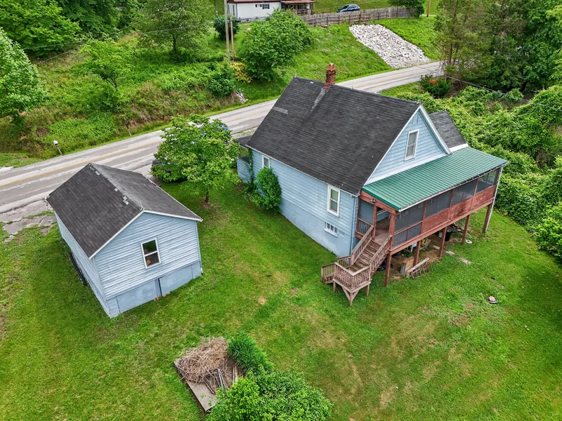 Aerial photo of a rural house alongside a road