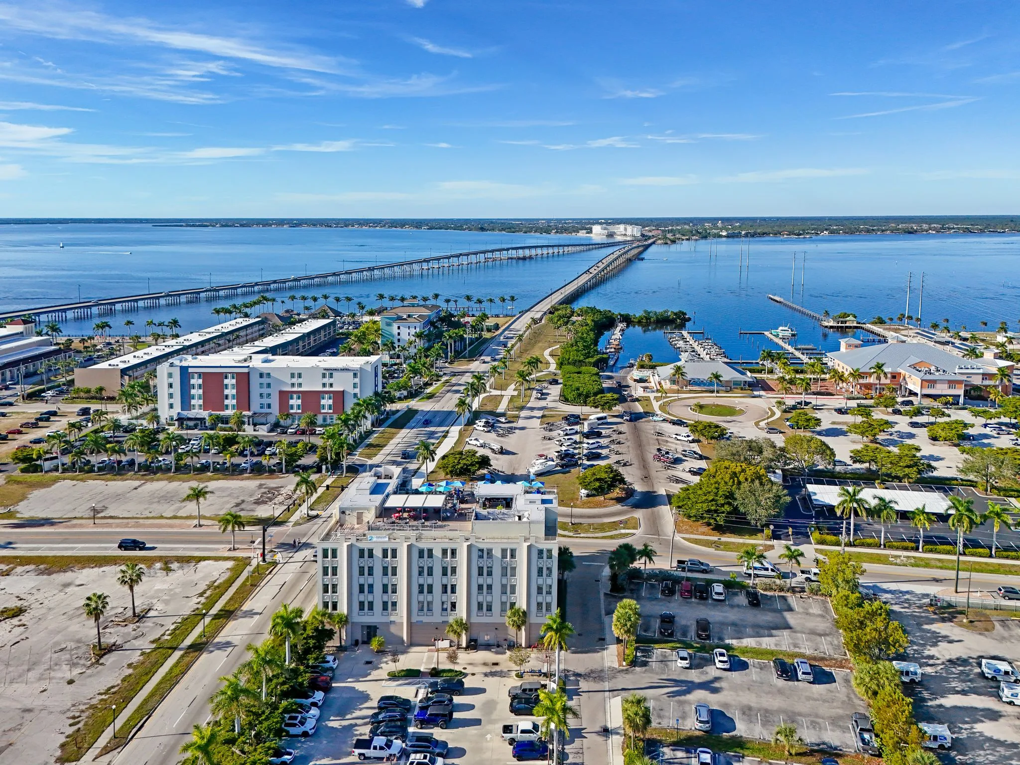 Aerial drone photo of a coastal causeway and marina