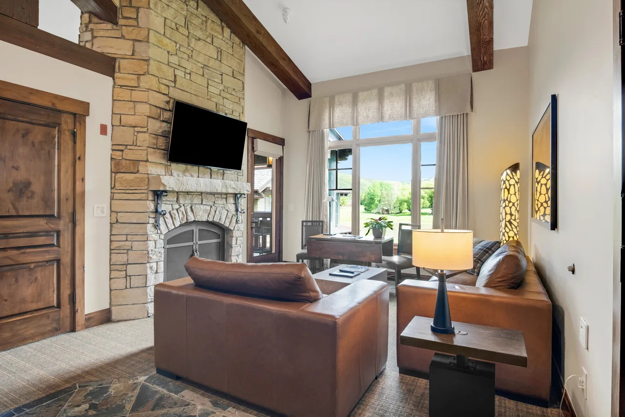 Hotel suite living area with fireplace