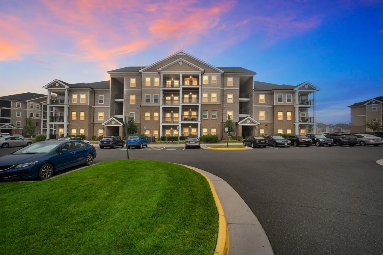 Apartment community exterior at dusk