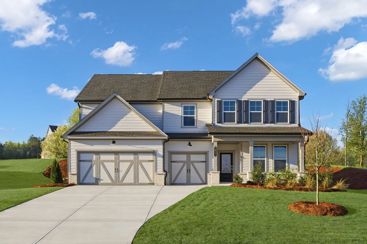 Two-story single-family home with a front lawn